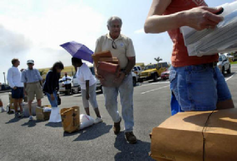 PORT ST. LUCIE - “I’ve never seen this done before. My hat’s off to the city for providing this service,” said Dan Spinogatti, center, of St. Lucie West, who was one of many people who waited in line to have papers with sensitive material shredded Tuesday morning at the Port St. Lucie Civic Center. The event was initiated by the Port St. Lucie Police Department and the shredding services were provided by ShredAssured, of West Palm Beach, who donated their time. PORT ST. LUCIE - “I’ve never seen this done before. My hat’s off to the city for providing this service,” said Dan Spinogatti, center, of St. Lucie West, who was one of many people who waited in line to have papers with sensitive material shredded Tuesday morning at the Port St. Lucie Civic Center. The event was initiated by the Port St. Lucie Police Department and the shredding services were provided by ShredAssured, of West Palm Beach, who donated their time.